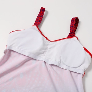 Detailed close-up of swimsuit interior featuring built-in chest pads and red elastic band