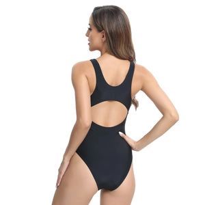 Close-up of racerback design and cutout detail on black athletic one-piece swimsuit