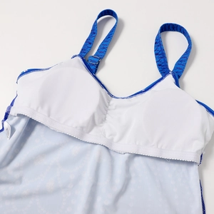Detail of blue printed swimwear featuring adjustable straps and internal padded lining