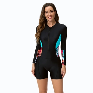 Detail view of long-sleeve swimsuit with blue leopard print and front zipper closure
