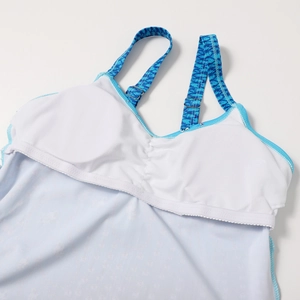 Detailed view of adjustable shoulder straps and mesh lining on printed bikini top