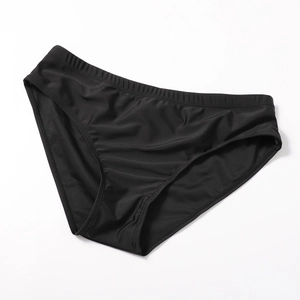 Detailed flat lay of black high-elastic quick-dry swim briefs for men with elastic waist