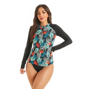 Women's two-piece long sleeve swimsuit with tropical palm leaf print and front zipper