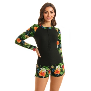 Women's two-piece long sleeve sun protection swimsuit with tropical floral print design