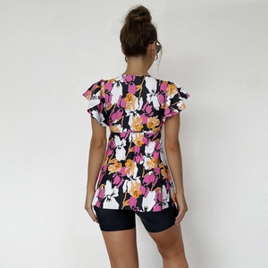 Floral print short sleeve tankini top with ruffled cuffs and black swim shorts detail