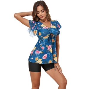 Detail of plus size floral tankini top with V-neck, butterfly sleeves and black boy shorts