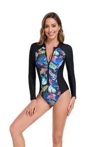 Close-up of long sleeve one-piece swimsuit with front zipper and tropical leaf print