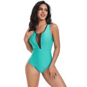 Detailed view of women one-piece swimsuit with mint green fabric and black mesh V-neckline