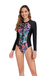 Detail of long sleeve swimsuit with front zipper and vibrant tropical leaf print pattern