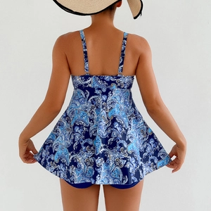 Rear view of navy paisley print tankini dress with adjustable straps and coverage