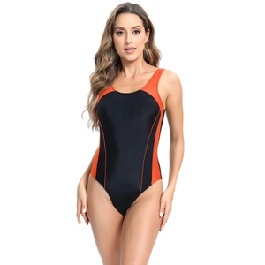 Detail view of athletic one-piece swimsuit with orange and black color-block contrast