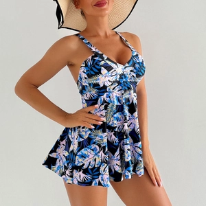 Detail of V-neck tankini swim dress with tropical palm leaf print and A-line skirt cut
