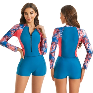 Detailed front and back view of long sleeve surfing swimsuit with palm leaf print