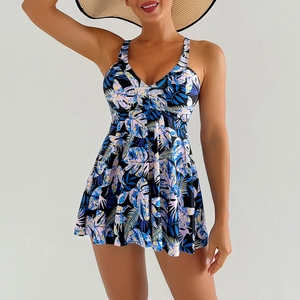 Detail view of tankini swimdress with vibrant tropical leaf print and A-line skirt design