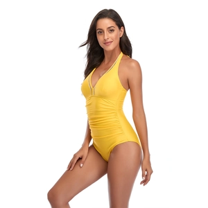 Detail of yellow one-piece swimsuit with V-neckline and black-white checkered trim
