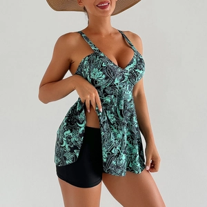 Detail of teal floral tankini top with V-neck and black high-waisted swim shorts