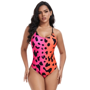 Detail of pink gradient one-piece swimsuit with cow print and black ring straps
