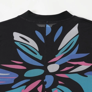 Close-up of black mesh surf suit with abstract floral print and breathable fabric