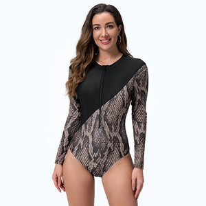 Detailed view of the front metal zipper and snakeskin print on long sleeve swimsuit