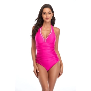 Detail of hot pink ruched one-piece swimsuit with halter V-neck and silver trim