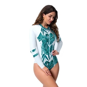 Women's long sleeve one-piece surfing swimsuit featuring tropical green leaf prints