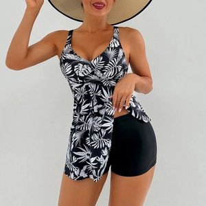 Detail of V-neck tankini top with white palm leaf print and crossover pleated chest design