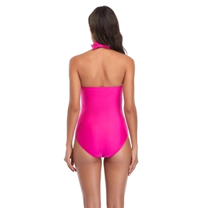 Back view of a hot pink one-piece swimsuit featuring a halter neck with a bow tie detail