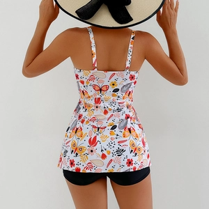 Rear view of two-piece swimsuit with floral butterfly print top and black swim shorts