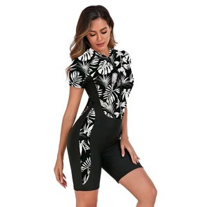Short sleeve one-piece swimsuit with tropical leaf print and front zipper detail