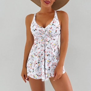 Detail of tropical leaf print bikini with deep V-neckline and waist wrap design