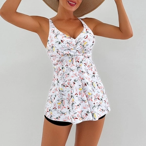 Detail of floral print tankini set with V-neck knot top and black swim shorts