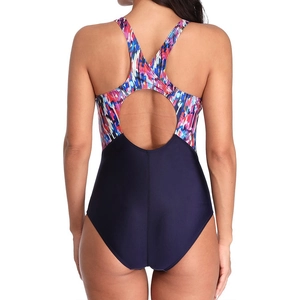 Detail of racerback one-piece swimsuit featuring geometric print and circular back cutout