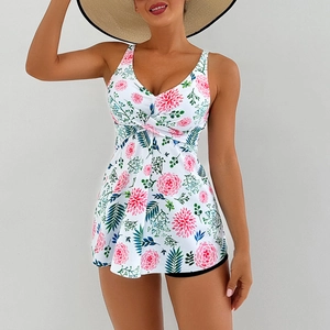 Detail of floral print tankini swimsuit with twisted V-neck and pleated A-line skirt