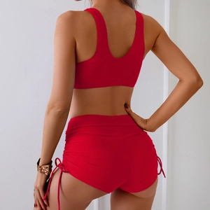 Rear view of red two-piece bikini set featuring racerback top and drawstring shorts