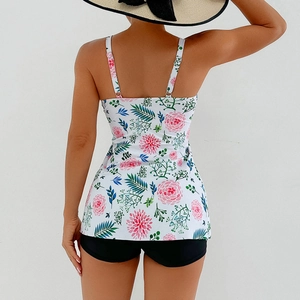 Back view of floral tankini swim top with adjustable straps and black high waist swim shorts