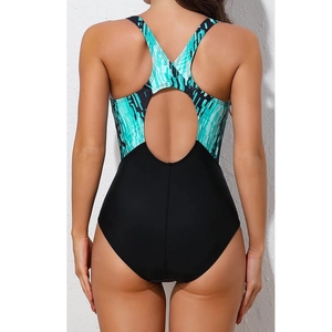 Detail of athletic one-piece swimsuit featuring racerback cut-out and printed patchwork