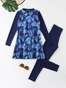Two-piece long sleeve swimwear with blue tropical leaf print and matching leggings