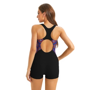 Detailed back view of a black racerback swimsuit featuring colorful geometric mandala patterns