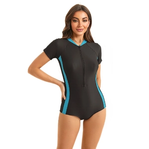 Close-up of short sleeve surfing swimsuit with blue contrast trim and front zipper