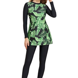 Long-sleeve two-piece modest swimsuit set with tropical green leaf print and black leggings