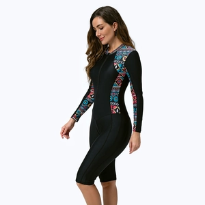 Detail of long sleeve rash guard featuring tribal prints and front zipper closure