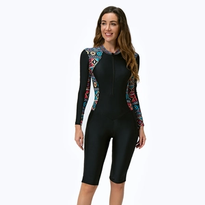 Detailed view of women's long sleeve one-piece swimsuit with ethnic print and front zipper