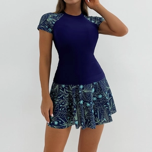 Detailed view of women's two-piece swimdress with floral print sleeves and A-line skirt