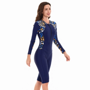 Detail of long sleeve surfboard swimsuit with animal print side panels and front zipper