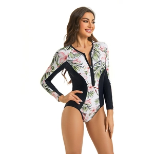 Close-up of long sleeve floral surfing swimsuit with front zipper and tropical prints