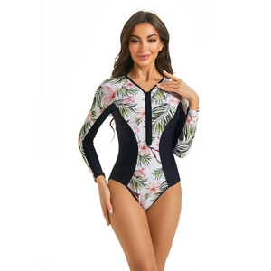 Detailed close-up of long sleeve floral one-piece swimsuit with front zipper and side panels