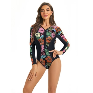 Detail of long sleeve one-piece swimsuit with tropical floral print and V-neck front zipper