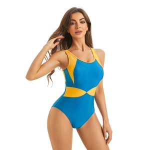 Close-up of blue one-piece swimsuit with yellow contrast side panels for a slimming look