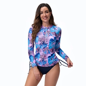 Detail of long sleeve surfboard swimsuit with tropical leopard print and white front zipper