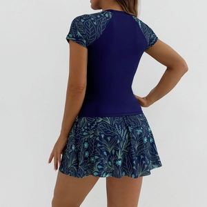 Two-piece navy blue swimsuit with floral print short sleeves and swim skirt back view